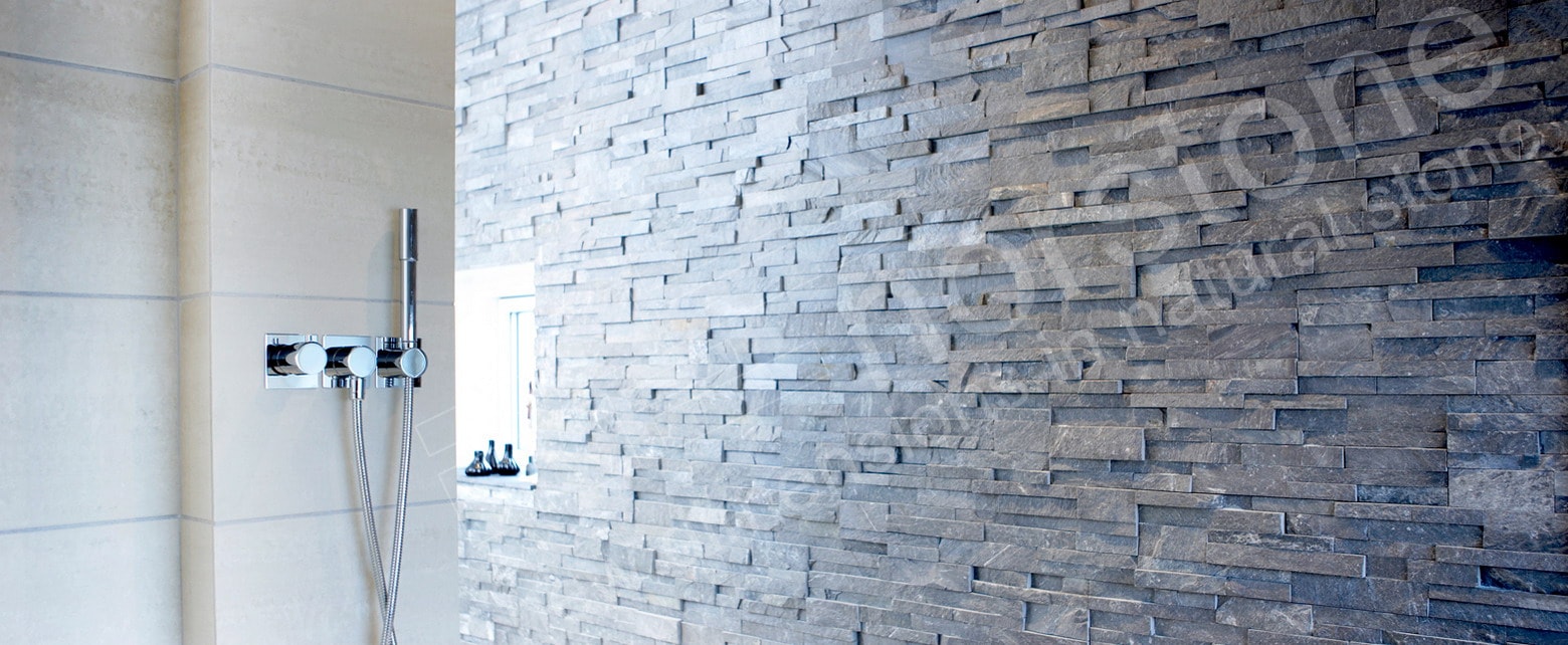 Charcoal Rock Panels used on an accent wall in a large walk in doorless shower